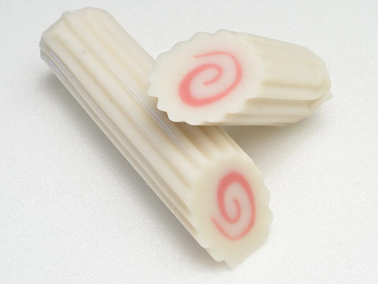 Narutomaki fish cake. Actual narutomaki fish cake with its characteristic pink spiral. The original source identifies this fish-cake product.