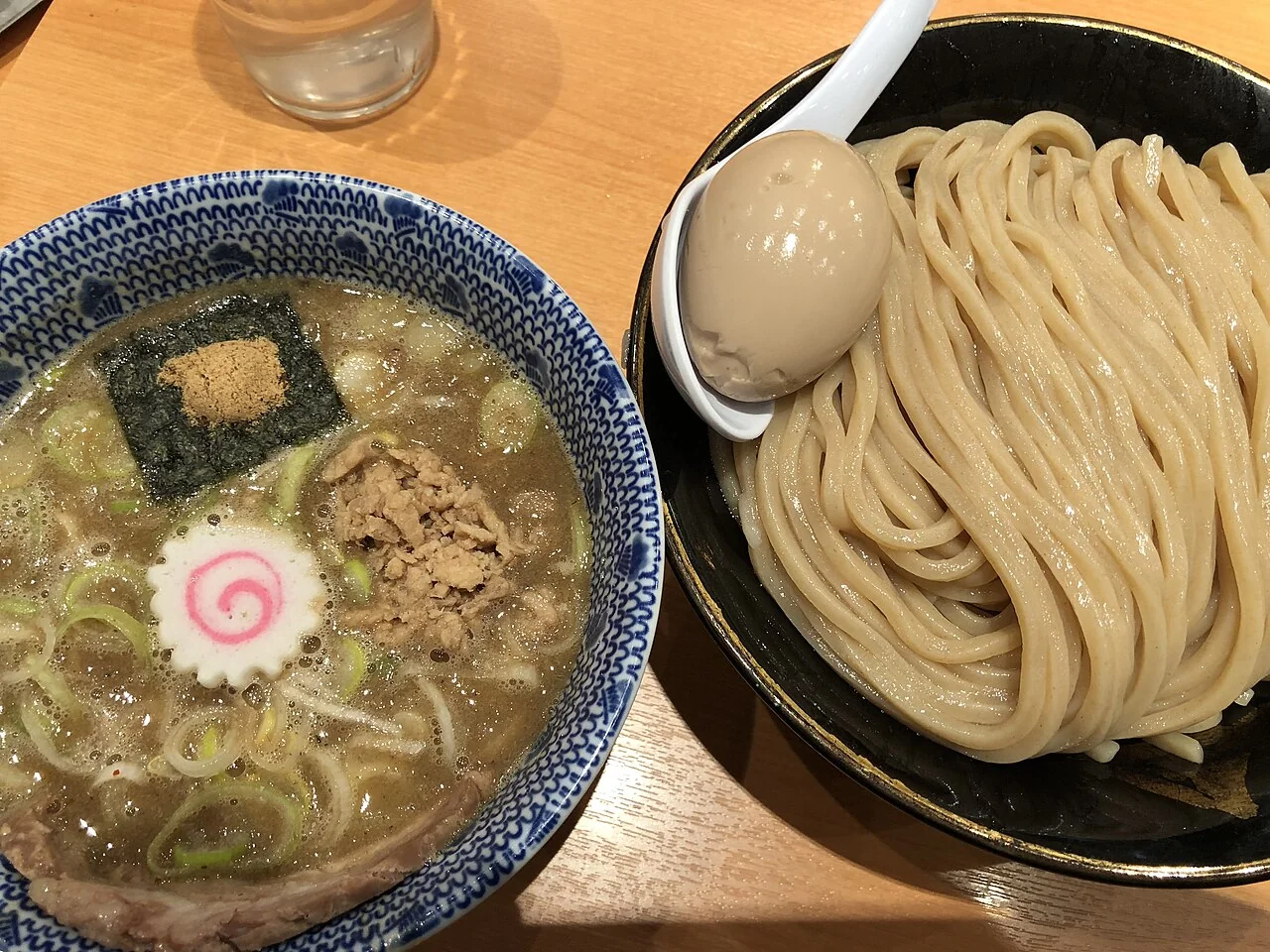 Thick noodles and dipping broth in separate bowls at Rokurinsha, Tokyo Ramen Street.